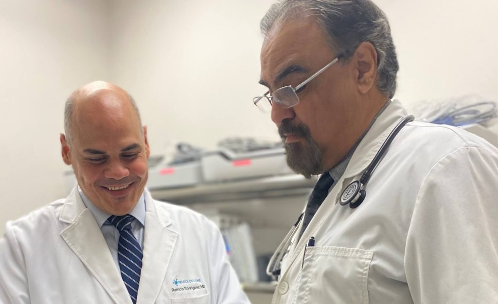 Dr. Ramon Rodriguez and Dr. Edgardo Rivera of Charter Research discuss plans for the clinical trial of gantenerumab.