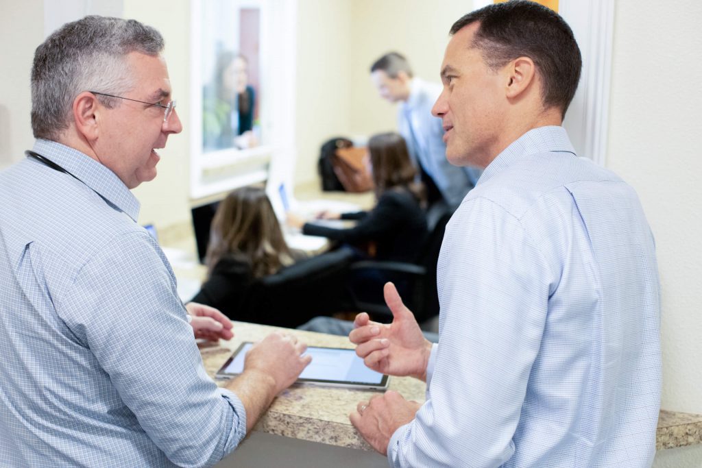 Dr. Jeffrey Norton (left) and Jeff Pohlig (right) of Charter Research discuss the care of participants in Eli Lilly's Phase 3 clinical trials of donanemab.