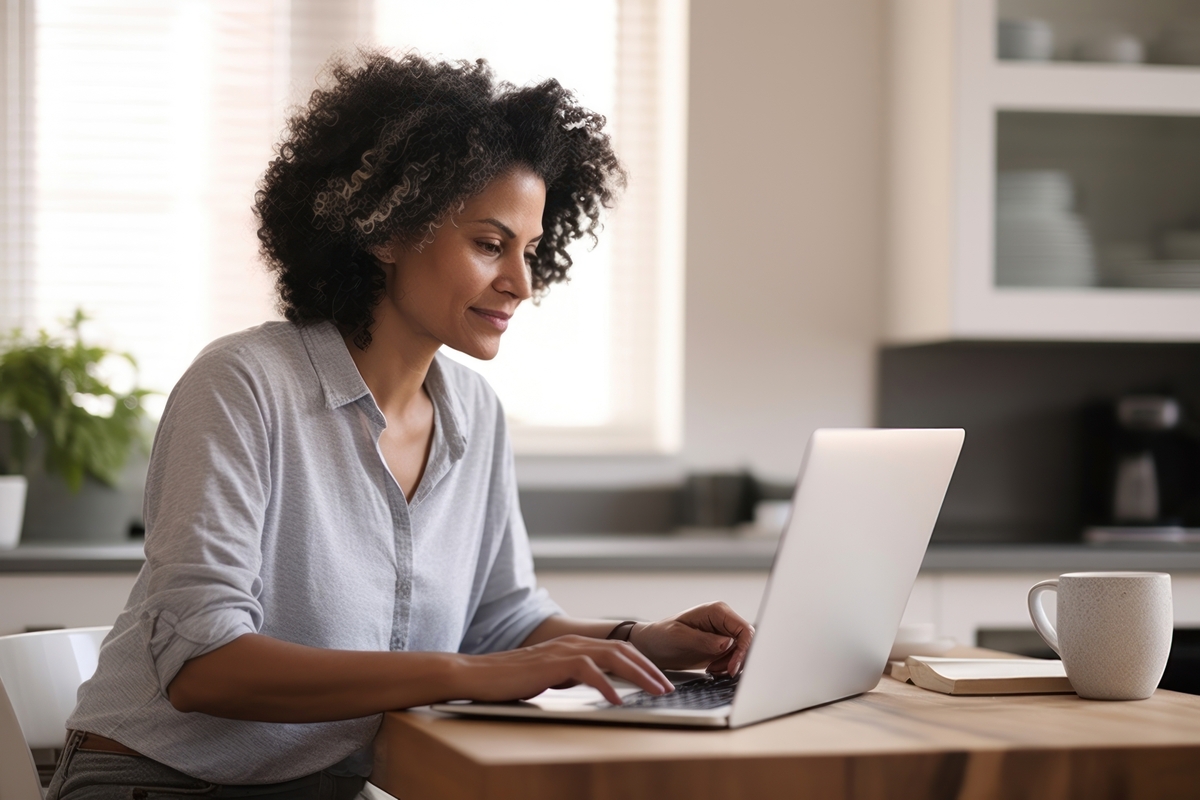 What is early onset Alzheimer's? Woman working on a laptop.